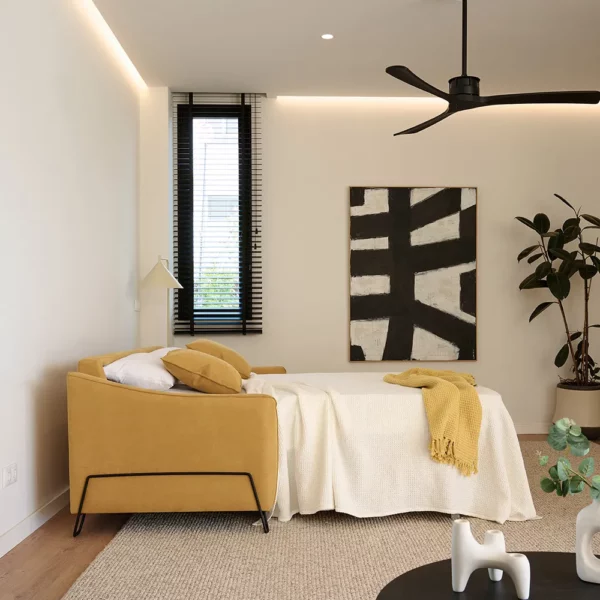 Sofá cama modelo ADE abierto en una habitación